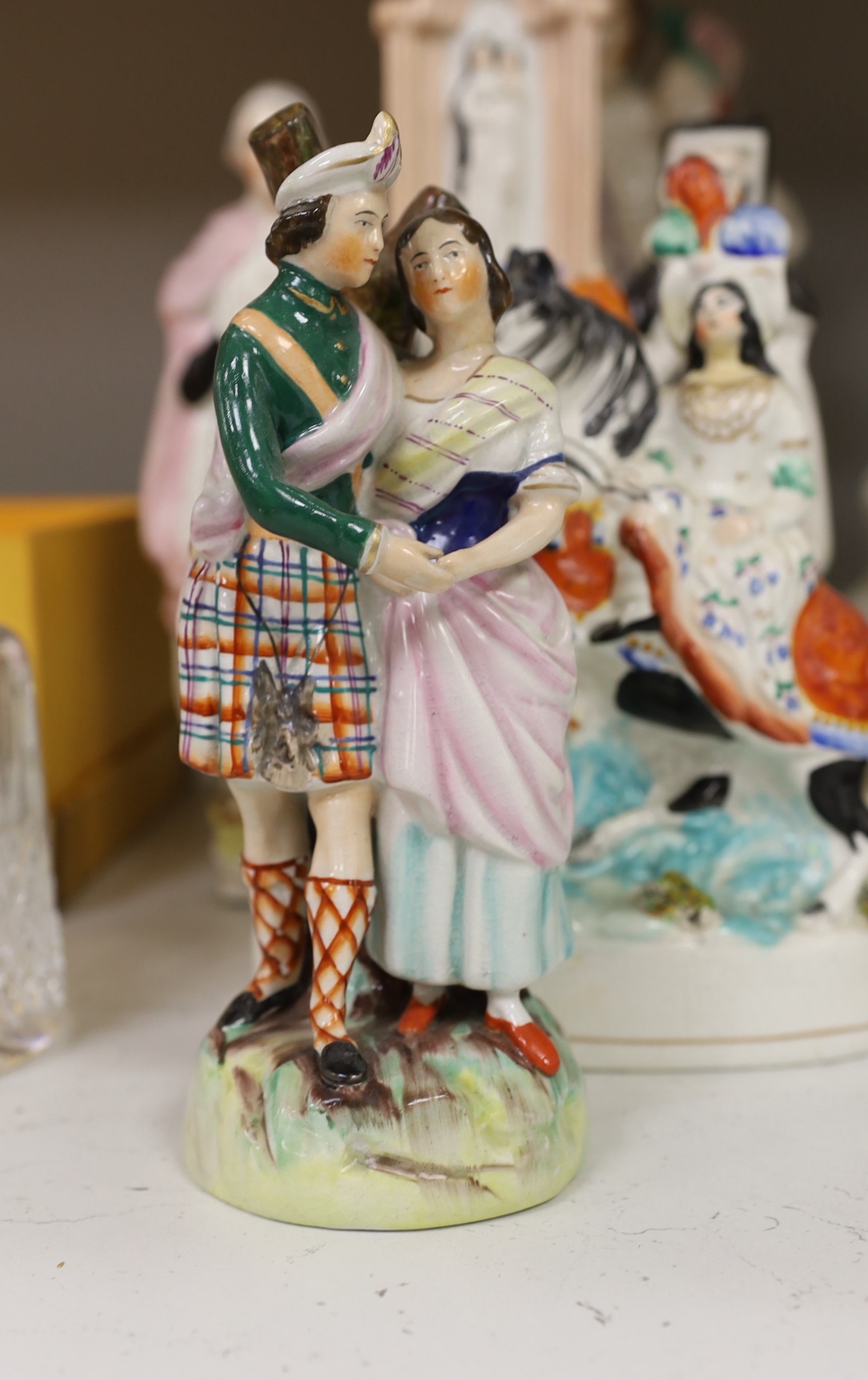 A collection of eight Victorian Staffordshire figures or groups, largest 36cm
